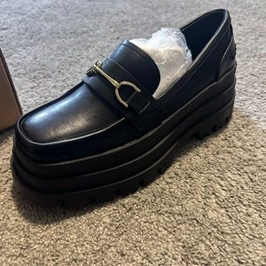 Black platform shoes.